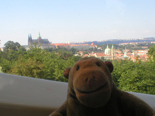 Mr Monkey looking at Prague Castle from the funicular