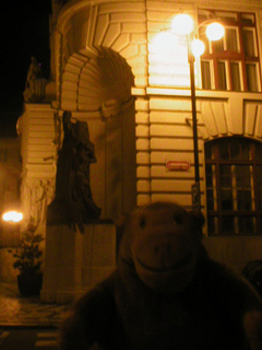 Mr Monkey looking at the statue of Rabbi Low on the New Town Hall