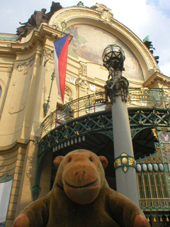 Mr Monkey looking at the front of the Municipal House