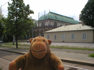 Mr Monkey looking across the tram lines to the Belvedere