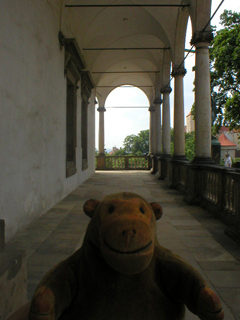 Mr Monkey walking along the colonade of the Belvedere
