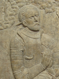 An armoured knight on a tombstone