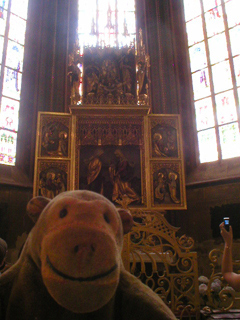 Mr Monkey looking at a chapel in the apse
