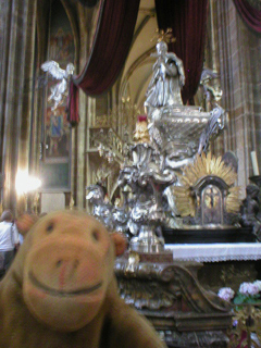 Mr Monkey looking at the monument of St John Nepomuk