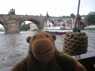 Mr Monkey looking at Charles Bridge from the river
