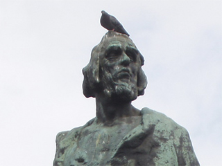 Jan Hus with a pigeon on his head