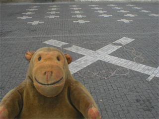 Mr Monkey looking at the white crosses on the Old Town Square