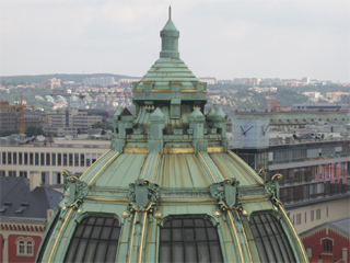 The copper dome on top of the Municipal House