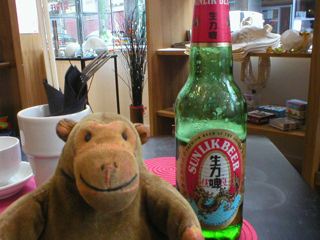 Mr Monkey relaxing with Mr Rik's beer before the gallery tour