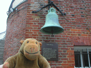 Mr Monkey looking at the old Town Hall bell