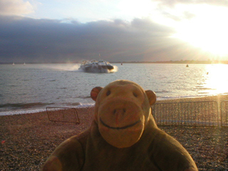 Mr Monkey watching a hovercraft approaching Southsea