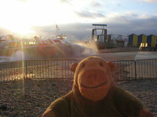 Mr Monkey watching a hovercraft going up the landing ramp