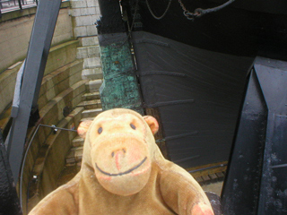 Mr Monkey looking at the rudder of HMS Victory