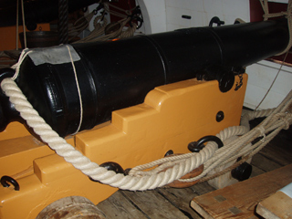A 32 pounder gun at a closed gun port