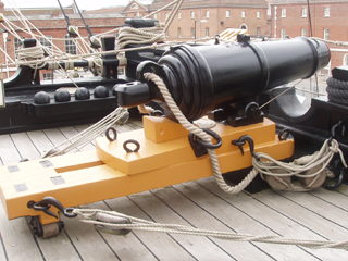 A 68 pounder carronade on an open deck