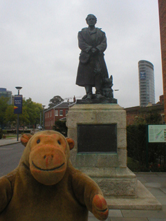 Mr Monkey looking at the statue of Captain Scott