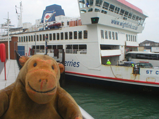 Mr Monkey watching the IOW car ferry scraping into  harbour