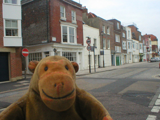 Mr Monkey walking along Broad Street