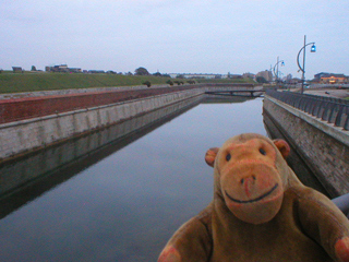Mr Monkey looking at the long curtain wall in Portsmouth