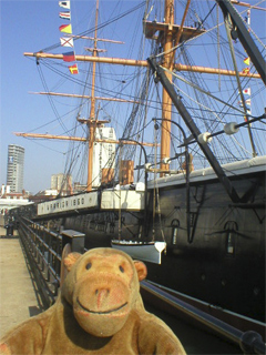 Mr Monkey looking along the side of HMS Warrior