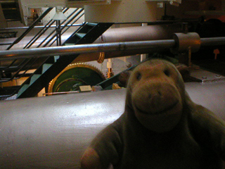 Mr Monkey looking at the engines of HMS Warrior