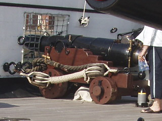 An Armstrong 40 pounder breech loader on an open deck