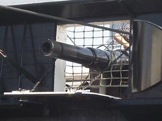 The muzzle of an Armstrong 40 pounder projecting from a gunport