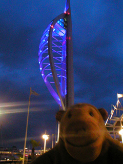Mr Monkey looking at the Spinnaker Tower at dusk