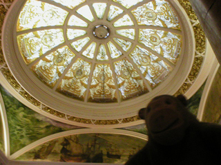 Mr Monkey looking up at the dome in the hotel lobby