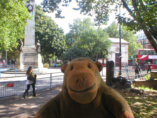 Mr Monkey looking at the war memorial outside Euston Station