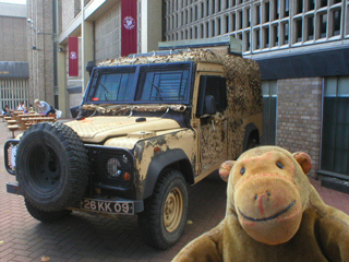 Mr Monkey looking at a Land Rover outside the National Army Museum