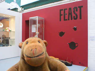 Mr Monkey checking that the exhibition is called Feast