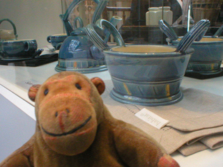 Mr Monkey looking at bowls and teapots by Sean Gordon
