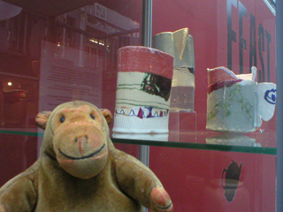 Mr Monkey looking at ceramics by Amy Lewis