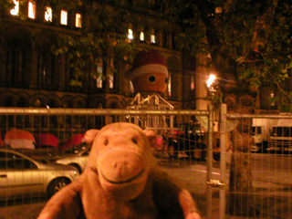 Mr Monkey looking at the giant head in Albert Square