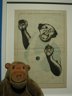 Mr Monkey looking at a poster captioned HALLELUJAH! THE MIGHT AND THE POWER OF THE PEOPLE IS BEGINNING TO SHOW 