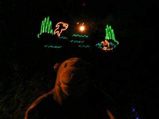 Mr Monkey looking at an animated illumination