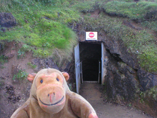 Mr Monkey looking at the exit from the Great Masson Caverns