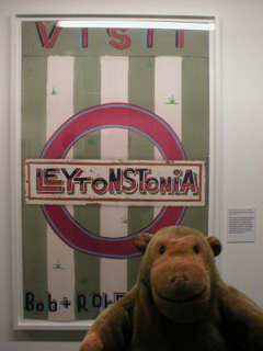 Mr Monkey looking at the artwork for Visit Leytonstonia