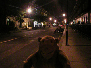 Mr Monkey walking through London at night