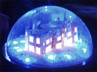 A model of Saltwell Towers lit in blue in the first globe