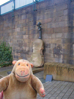 Mr Monkey looking at the monument to James Hill