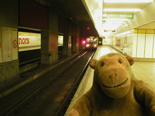 Mr Monkey catching a train at Manors Metro station