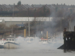 Clouds of smoke around the mouth of Wiilington Quay