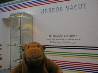Mr Monkey looking at the exhibition area