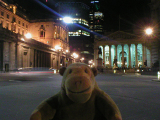Mr Monkey looking at the Bank of England and the Royal Exchange at night