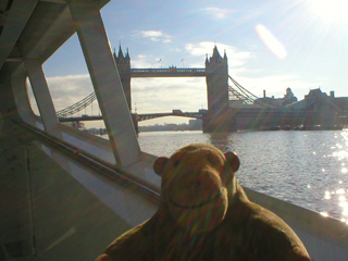 Mr Monkey looking approaching Tower Bridge by boat