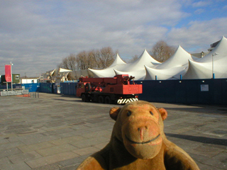 Mr Monkey looking at the Cutty Sark being repaired