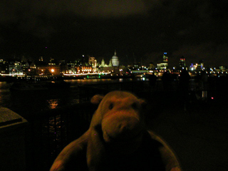 Mr Monkey looking down the Thames at night