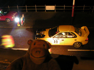 Mr Monkey looking down on car 35 at the check point